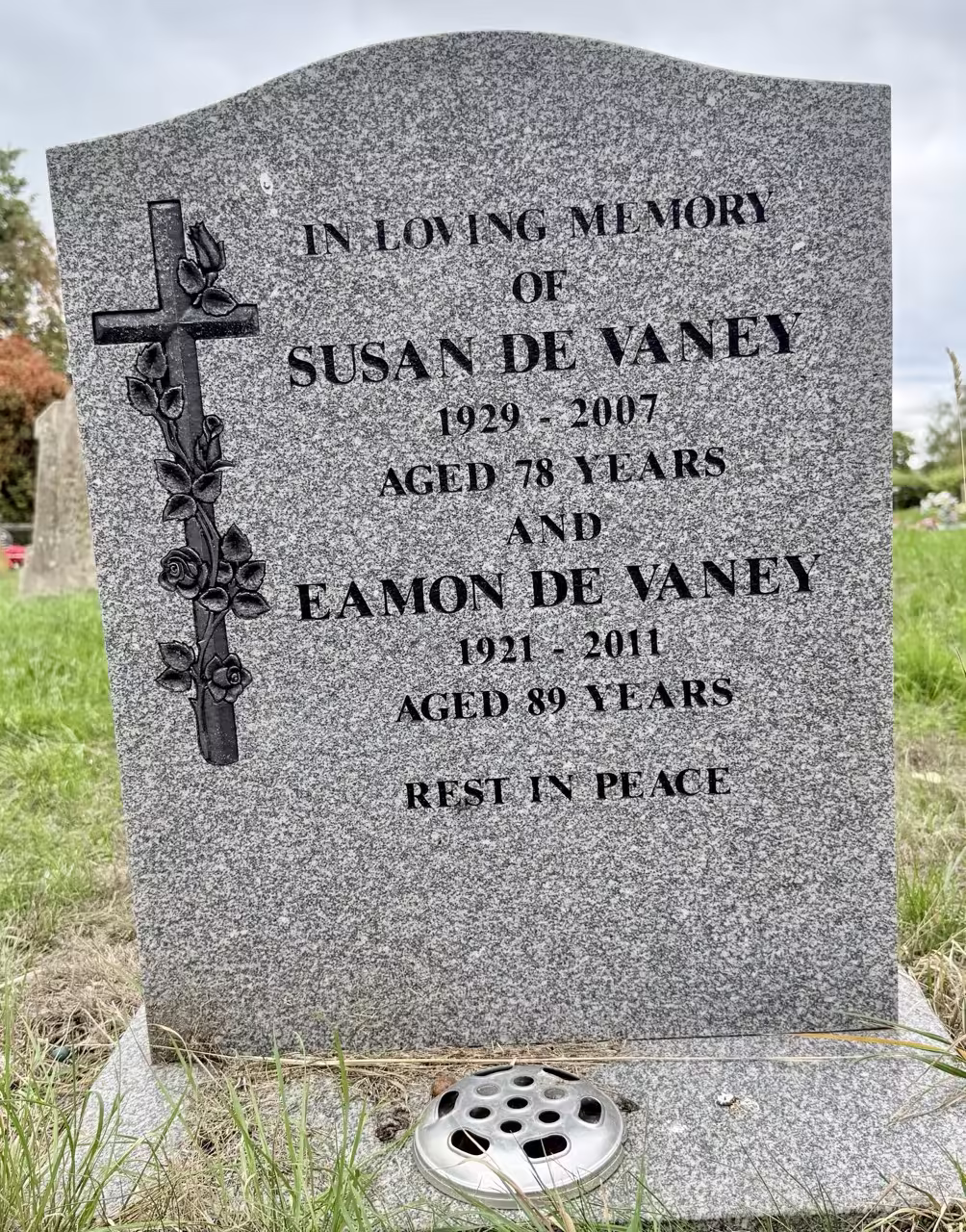 Wooden cross with metal nameplate